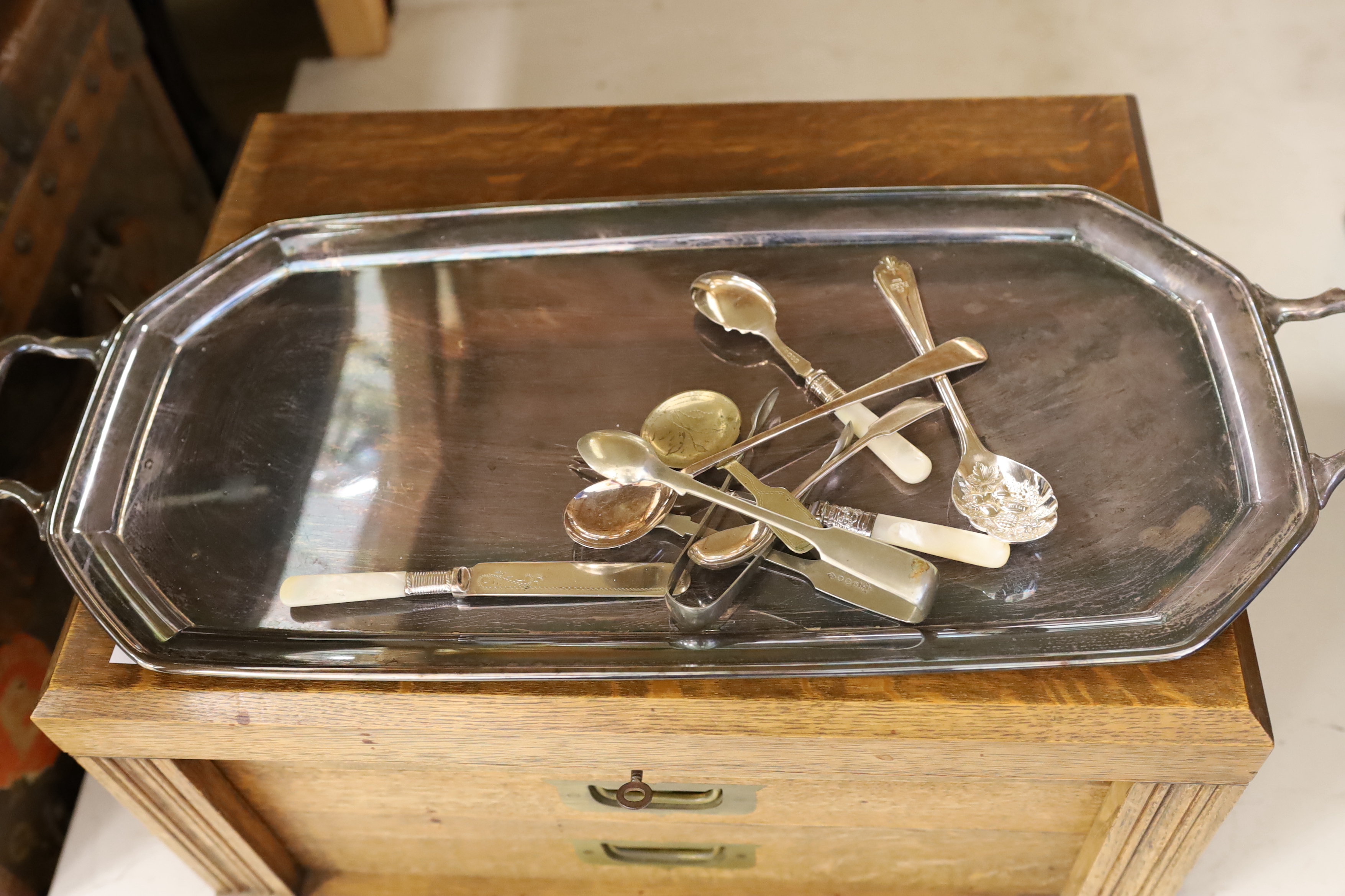 An oak cased set of twelve pair of silver plated cutlery and other plated wares